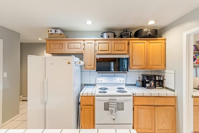 kitchen with white appliances, tile countertops, light tile patterned floors, a baseboard heating unit, and recessed lighting