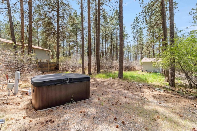 view of yard with a hot tub