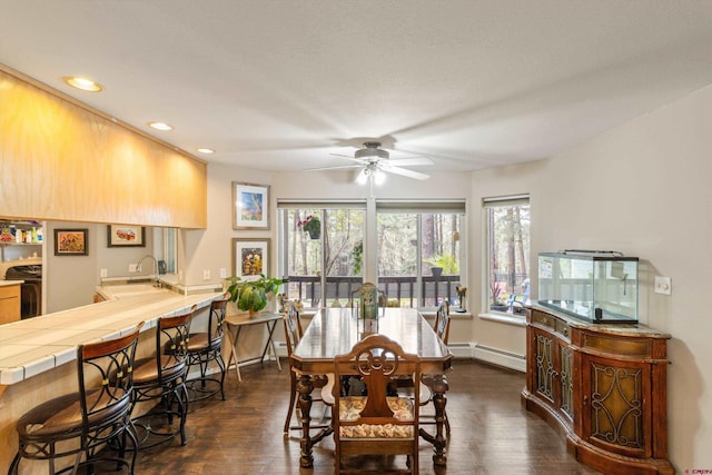 dining room with ceiling fan, dark wood-style floors, baseboards, a baseboard radiator, and recessed lighting