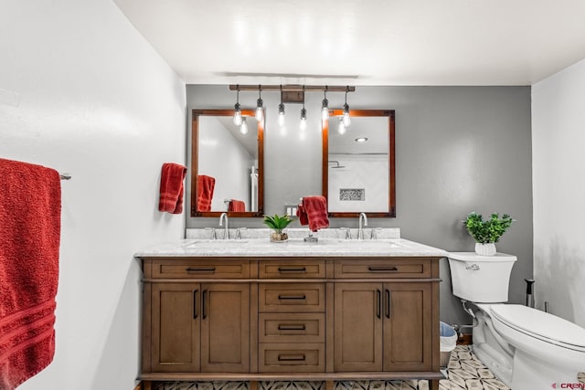 1257 Snowden St, Silverton, CO 81433 - full bathroom with toilet, double vanity, and baseboards