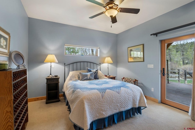 99 River Rd, Durango, CO 81301 - carpeted bedroom with access to outside, multiple windows, baseboards, and ceiling fan