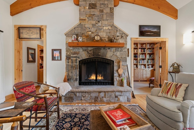 99 River Rd, Durango, CO 81301 - living area featuring vaulted ceiling, wood finished floors, and a fireplace