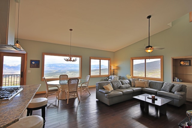 53315 Bull Basin Rd, Mesa, CO 81643 - living room with vaulted ceiling, dark wood-style flooring, a chandelier, baseboards, and a ceiling fan