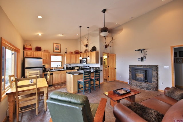 53315 Bull Basin Rd, Mesa, CO 81643 - living room featuring high vaulted ceiling, baseboards, and recessed lighting