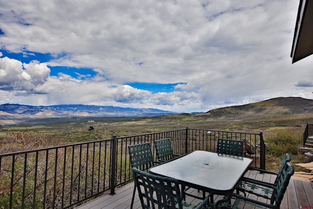53315 Bull Basin Rd, Mesa, CO 81643 - wooden terrace featuring outdoor dining area and a mountain view