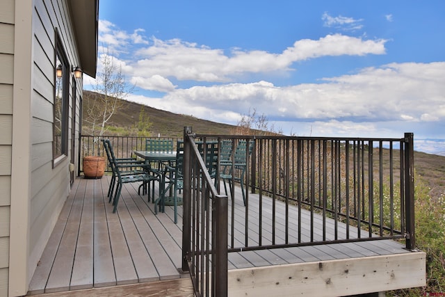 53315 Bull Basin Rd, Mesa, CO 81643 - deck with outdoor dining area and a mountain view