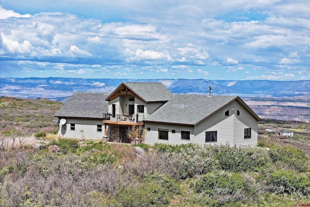 53315 Bull Basin Rd, Mesa, CO 81643 - view of front facade featuring a mountain view, a balcony, and roof with shingles