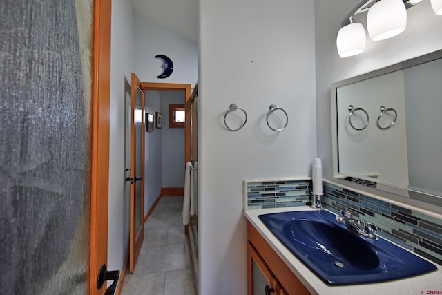 53315 Bull Basin Rd, Mesa, CO 81643 - bathroom featuring decorative backsplash, tile patterned floors, and vanity
