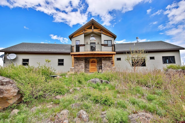53315 Bull Basin Rd, Mesa, CO 81643 - view of front of house with stone siding and a deck