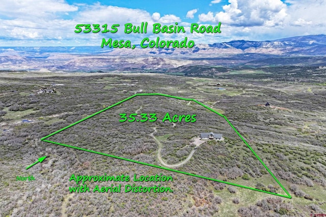 53315 Bull Basin Rd, Mesa, CO 81643 - aerial view of property and surrounding area with property boundaries highlighted and mountains