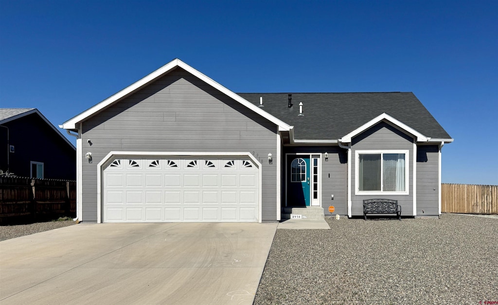 2918 Andersen Cir, Alamosa, CO 81101 - single story home featuring fence, driveway, and an attached garage