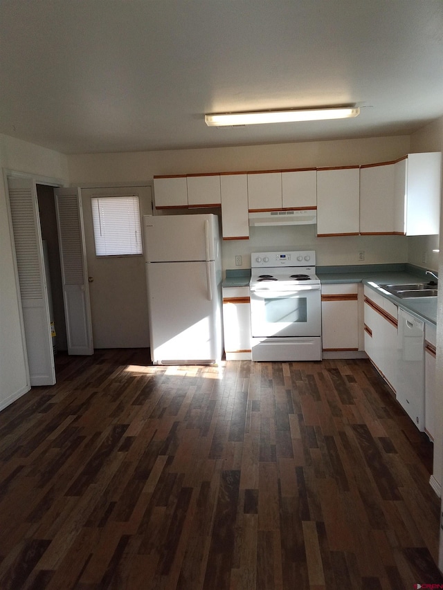 240 S Madison St, Cortez, CO 81321 - kitchen with white appliances, white cabinets, a sink, dark wood-type flooring, and under cabinet range hood