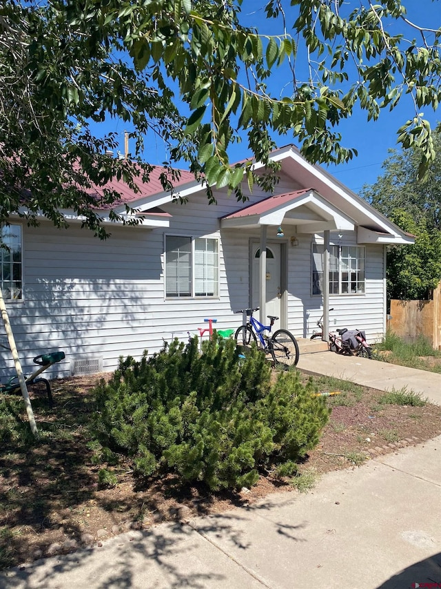 240 S Madison St, Cortez, CO 81321 - view of front of house featuring fence