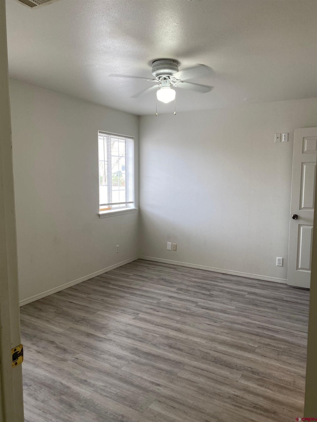 240 S Madison St, Cortez, CO 81321 - empty room with wood finished floors, ceiling fan, and baseboards