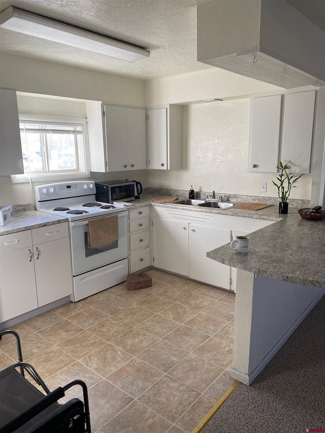 240 S Madison St, Cortez, CO 81321 - kitchen featuring electric stove, a sink, white cabinetry, and a textured ceiling