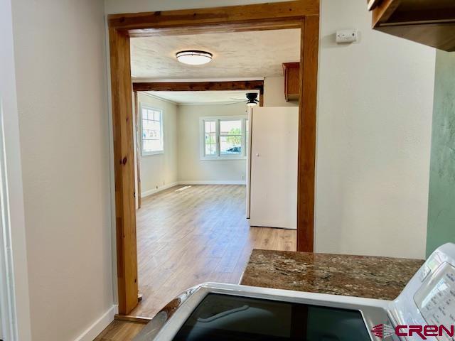1414 Bluff St, Delta, CO 81416 - hall featuring light wood-style floors and baseboards