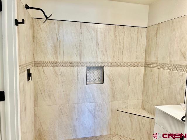 1414 Bluff St, Delta, CO 81416 - full bathroom featuring a tile shower
