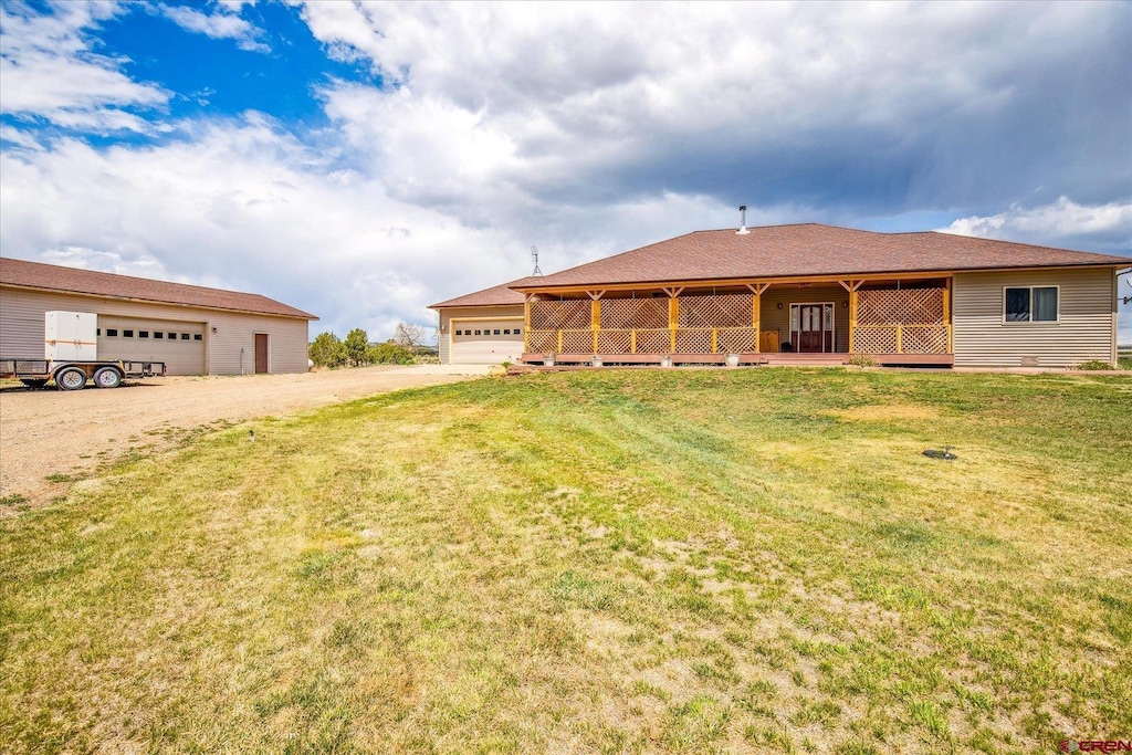 28725 Road P.8, Dolores, CO 81323 - ranch-style house featuring a front lawn and a detached garage