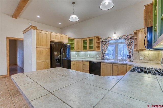 39 Garnet Ct, Pagosa Springs, CO 81147 - kitchen with open shelves, black appliances, a sink, decorative backsplash, and a peninsula
