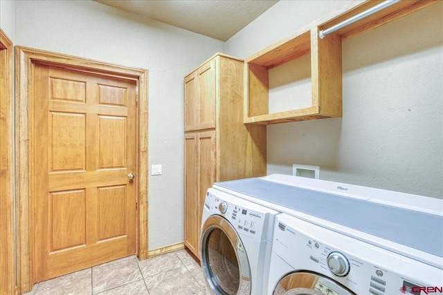 39 Garnet Ct, Pagosa Springs, CO 81147 - clothes washing area featuring washer and clothes dryer, cabinet space, and light tile patterned floors