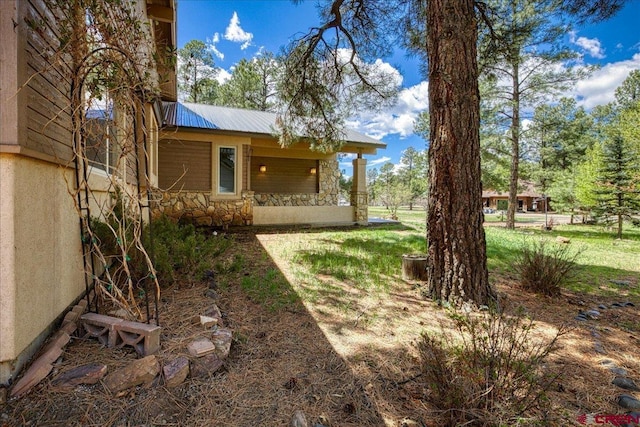39 Garnet Ct, Pagosa Springs, CO 81147 - view of grassy yard with covered porch