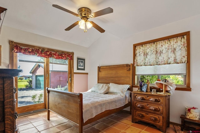 bedroom featuring access to outside, vaulted ceiling, tile patterned flooring, and a ceiling fan