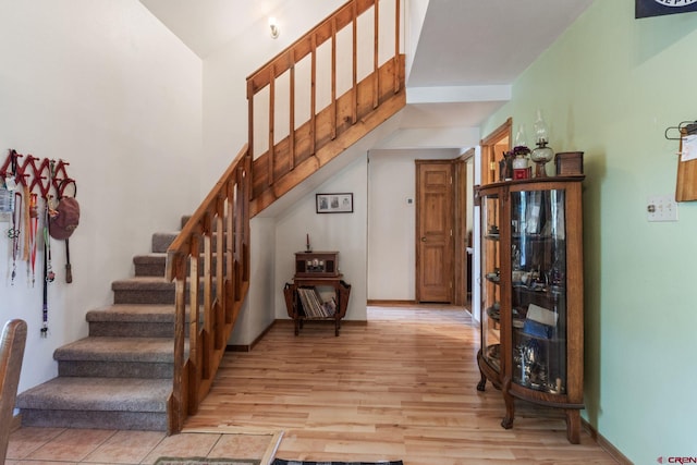 stairway featuring wood finished floors