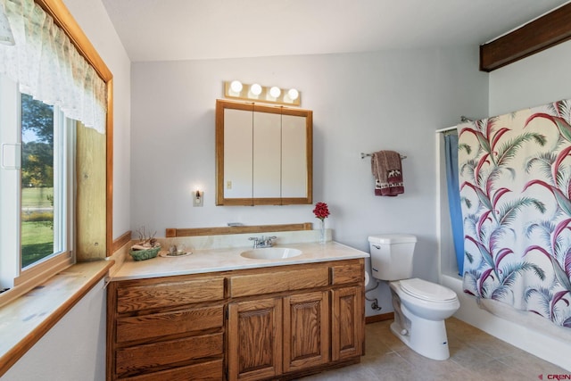 bathroom with vanity, tile patterned floors, toilet, and shower / bath combination with curtain