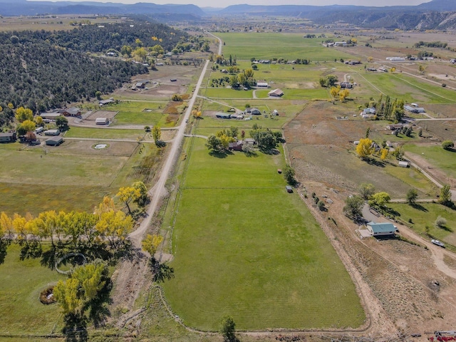 aerial view of property's location featuring rural landscape and mountains