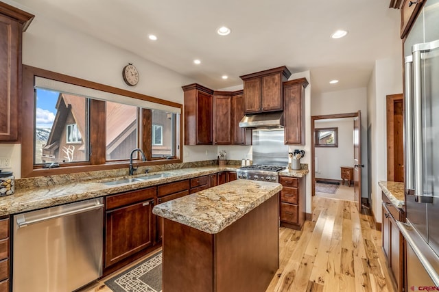 32 Cinnamon Mountain Rd, Mount Crested Butte, CO 81225 - kitchen featuring stainless steel appliances, under cabinet range hood, a sink, light stone countertops, and recessed lighting