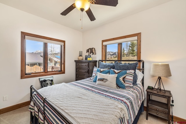 32 Cinnamon Mountain Rd, Mount Crested Butte, CO 81225 - bedroom with carpet, baseboards, and a ceiling fan