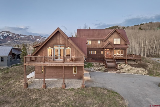 32 Cinnamon Mountain Rd, Mount Crested Butte, CO 81225 - view of front facade with a wooden deck and stairs