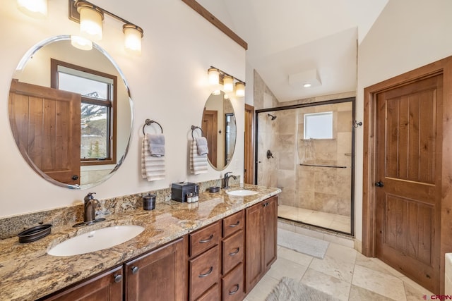 32 Cinnamon Mountain Rd, Mount Crested Butte, CO 81225 - full bathroom featuring a stall shower, healthy amount of natural light, double vanity, and tile patterned flooring