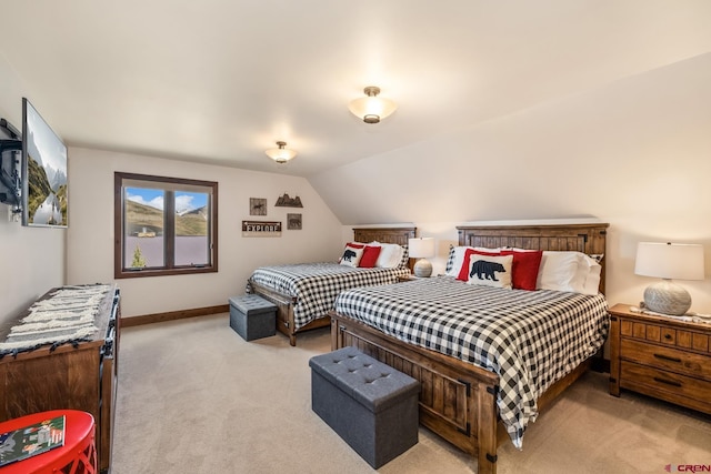 32 Cinnamon Mountain Rd, Mount Crested Butte, CO 81225 - bedroom featuring light carpet, lofted ceiling, and baseboards