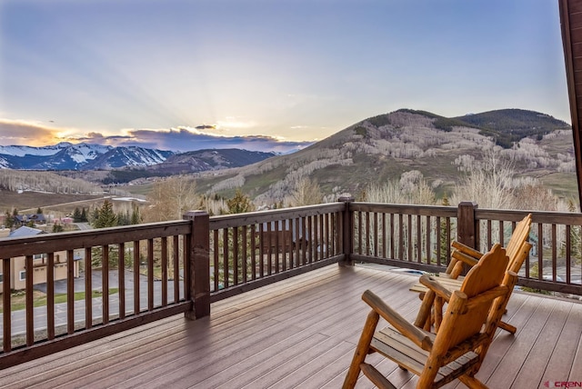 32 Cinnamon Mountain Rd, Mount Crested Butte, CO 81225 - deck at dusk with a mountain view