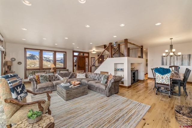 32 Cinnamon Mountain Rd, Mount Crested Butte, CO 81225 - living room featuring a chandelier, light wood-style floors, stairway, and recessed lighting