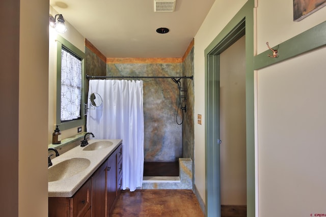 10491 54 7/10 Rd, Molina, CO 81646 - full bathroom featuring a tile shower, double vanity, and finished concrete flooring