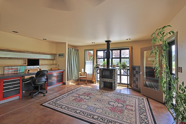 10491 54 7/10 Rd, Molina, CO 81646 - office space featuring a wood stove, concrete floors, and recessed lighting