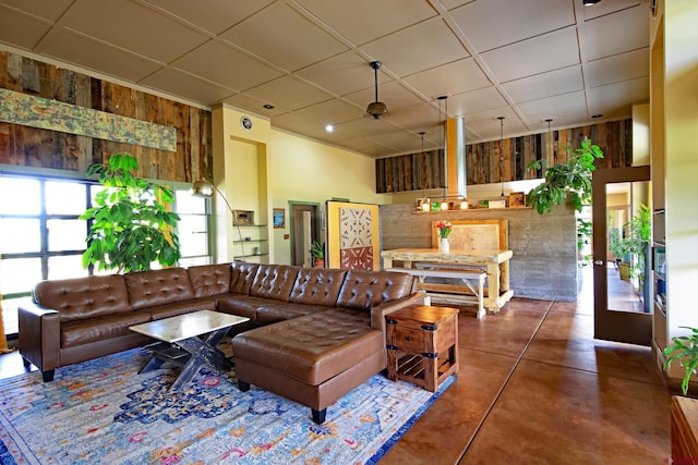 10491 54 7/10 Rd, Molina, CO 81646 - living room with wood walls, concrete floors, and a drop ceiling