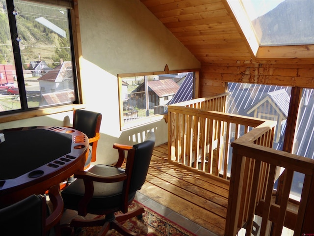 858 Reese St, Silverton, CO 81433 - interior space with hardwood / wood-style floors, lofted ceiling, wood walls, and a skylight