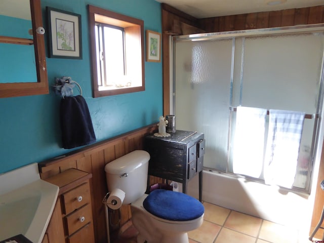 858 Reese St, Silverton, CO 81433 - full bath featuring bath / shower combo with glass door, toilet, tile patterned flooring, and vanity