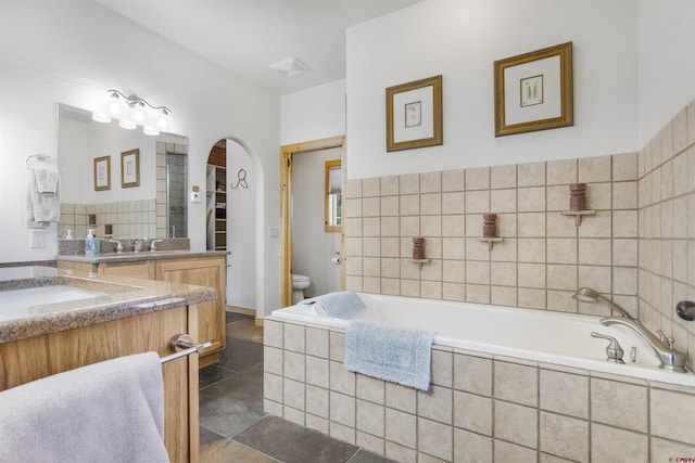 584 Oren Rd, Pagosa Springs, CO 81147 - full bathroom featuring toilet, vanity, and a bath