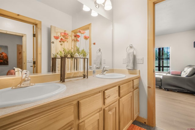 584 Oren Rd, Pagosa Springs, CO 81147 - bathroom featuring double vanity and wood finished floors