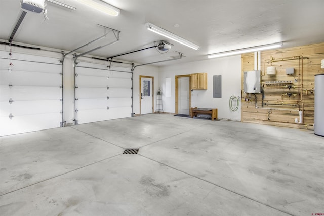 584 Oren Rd, Pagosa Springs, CO 81147 - garage with gas water heater, a garage door opener, and electric panel
