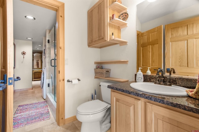 584 Oren Rd, Pagosa Springs, CO 81147 - bathroom featuring toilet, a shower stall, vanity, recessed lighting, and baseboards