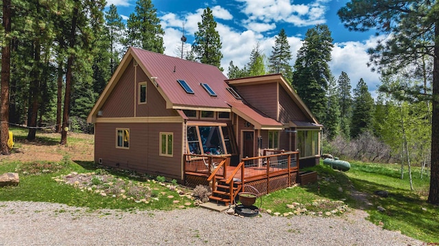 520 Los Ranchitos Dr, Durango, CO 81301 - view of front of home with a wooden deck, metal roof, and a view of trees