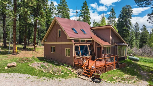 520 Los Ranchitos Dr, Durango, CO 81301 - rear view of property featuring a sunroom, a deck, and metal roof