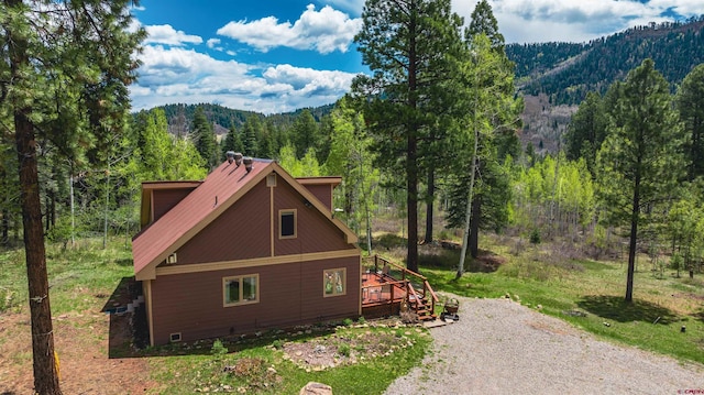 520 Los Ranchitos Dr, Durango, CO 81301 - view of side of home with a forest view and a deck with mountain view