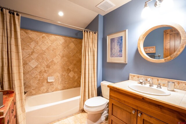 full bath featuring vanity, toilet, shower / bath combo, and tile patterned floors