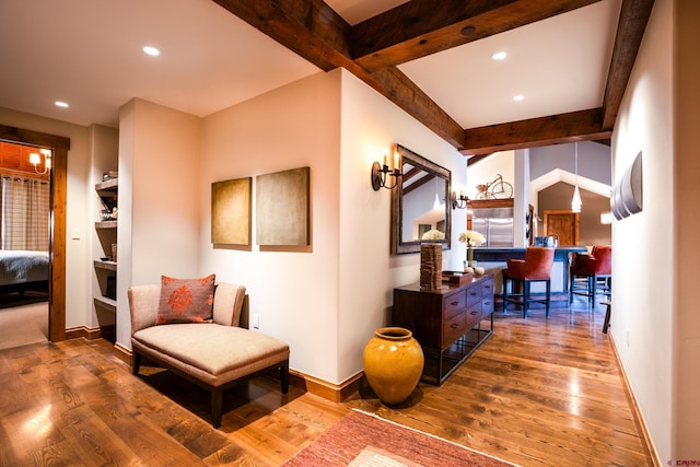 hall with wood finished floors, baseboards, recessed lighting, and beamed ceiling